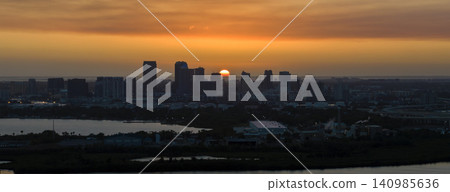 Aerial view of downtown district of Tampa city in Florida, USA at sunset. Dark silhouette of high skyscraper office buildings in modern american midtown Aerial view of downtown district of Tampa city in Florida, USA at sunset. Dark silhouette of high skyscraper office buildings in modern american midtown 140985636