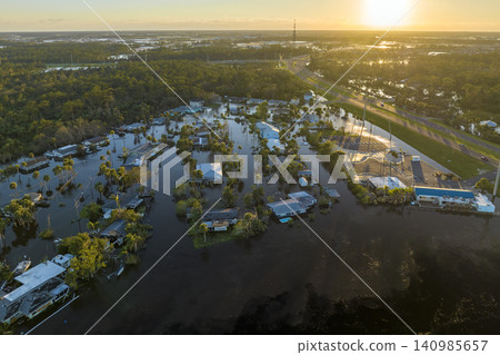Heavy flood with high water surrounding residential houses after hurricane Ian rainfall in Florida residential area. Consequences of natural disaster 140985657