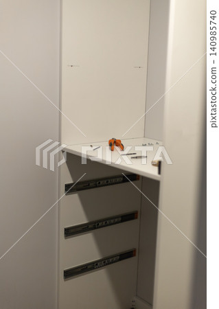 White server rack with hardware components and small tools White server rack with hardware components and small tools 140985740