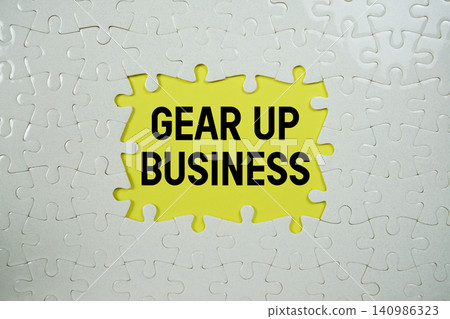Jigsaw puzzle with a missing piece with "Gear Up Business" on yellow background Jigsaw puzzle with a missing piece with "Gear Up Business" on yellow background 140986323