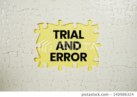 Jigsaw puzzle with a missing piece with "Trial And Error" on blue background Jigsaw puzzle with a missing piece with "Trial And Error" on blue background 140986324