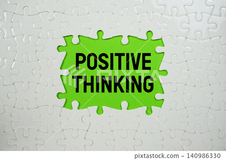 Jigsaw puzzle with a missing piece with "Positive Thinking" on green background Jigsaw puzzle with a missing piece with "Positive Thinking" on green background 140986330