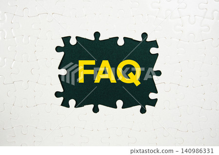 Jigsaw puzzle with a missing piece with "FAQ" on navy blue background Jigsaw puzzle with a missing piece with "FAQ" on navy blue background 140986331