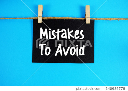Mistakes to Avoid paper notes hanging on the rope with clothespins Mistakes to Avoid paper notes hanging on the rope with clothespins 140986776