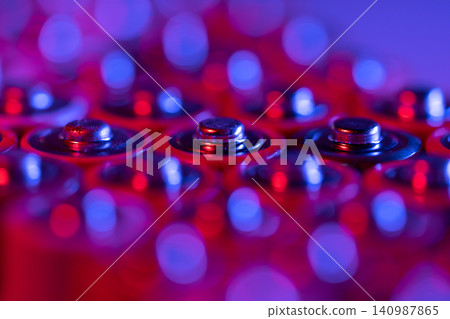 Closeup of positive ends of discharged batteries AA sizes, macro shot, selective focus. Used battery Closeup of positive ends of discharged batteries AA sizes, macro shot, selective focus. Used battery 140987865