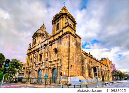 Historic colonial architecture and stone towers of the Santo Domingo Church under a cloudy sky in Santiago Chile Historic colonial architecture and stone towers of the Santo Domingo Church under a cloudy sky in Santiago Chile 140988025