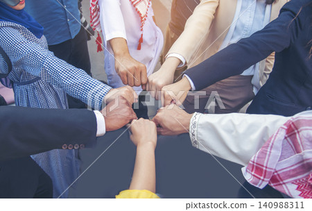 Diverse multiethnic Partners hands together teamwork group of multiracial people meeting join hands togetherness. Diversity people hands join empower partnership teams connection volunteer community Diverse multiethnic Partners hands together teamwork group of multiracial people meeting join hands togetherness. Diversity people hands join empower partnership teams connection volunteer community 140988311