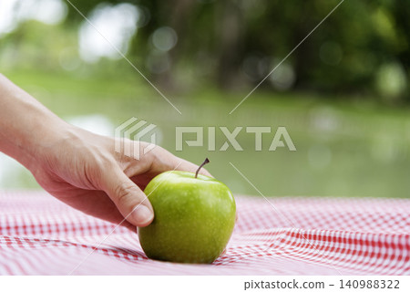 young asian woman eating Apple Healthy. Girl workout holding organic apple fruit healthy lifestyle. Wellness Asian women eat red apple smile face look at camera. Beauty health care lifestyle concept young asian woman eating Apple Healthy. Girl workout holding organic apple fruit healthy lifestyle. Wellness Asian women eat red apple smile face look at camera. Beauty health care lifestyle concept 140988322