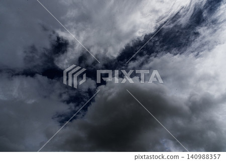 Dark rain cloud dramatic sky summer tropical thunder storm sky and fluffy black darkness cloud nearly raining cloudscape. Nimbus raincloud skyline climate background. Dark gray sky cloudy environment Dark rain cloud dramatic sky summer tropical thunder storm sky and fluffy black darkness cloud nearly raining cloudscape. Nimbus raincloud skyline climate background. Dark gray sky cloudy environment 140988357
