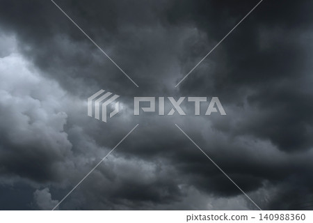 Dramatic dark storm rain clouds black sky background. Dark thunderstorm clouds rainny atmosphere. Meteorology danger windstorm disasters climate. Dark cloudscape storm disaster gloomy gray cloud sky Dramatic dark storm rain clouds black sky background. Dark thunderstorm clouds rainny atmosphere. Meteorology danger windstorm disasters climate. Dark cloudscape storm disaster gloomy gray cloud sky 140988360