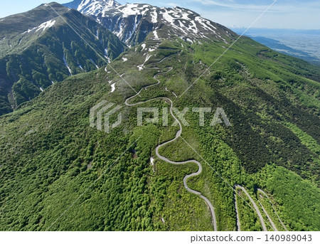 Springtime views of Mt. Chokai, Hokodate, and the Chokai Blue Line on a clear morning. 140989043