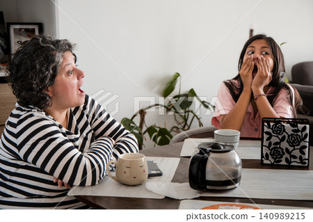 Mother and Daughter Having Fun Surprise Conversation Mother and Daughter Having Fun Surprise Conversation 140989215