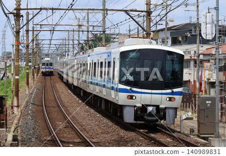 A Nankai Railway 7000 series train passing through Asakayama Station on the Koya Line. A Nankai Railway 7000 series train passing through Asakayama Station on the Koya Line. 140989831