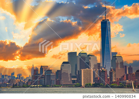 A beautiful sunset view of skyscrapers seen from a sightseeing boat. A beautiful sunset view of skyscrapers seen from a sightseeing boat. 140990834