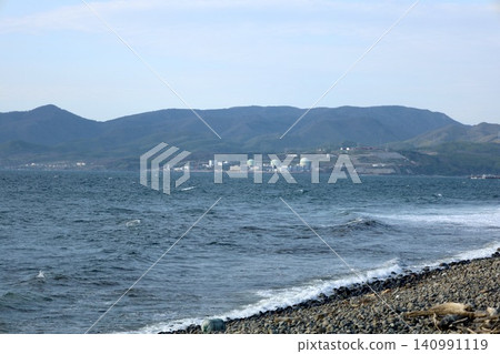 A view of the Hokkaido Electric Power Company's nuclear power plant in Tomari Village, seen from Raiden Coast in Iwanai Town, at the base of the Shakotan Peninsula in Shiribeshi, Hokkaido, in springtime. A view of the Hokkaido Electric Power Company's nuclear power plant in Tomari Village, seen from Raiden Coast in Iwanai Town, at the base of the Shakotan Peninsula in Shiribeshi, Hokkaido, in springtime. 140991119