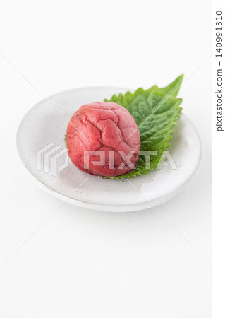 Shiso leaves and pickled plums on a small plate Shiso leaves and pickled plums on a small plate 140991310