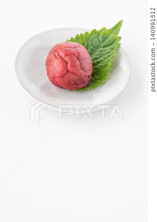 Shiso leaves and pickled plums on a small plate Shiso leaves and pickled plums on a small plate 140991312