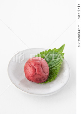 Shiso leaves and pickled plums on a small plate Shiso leaves and pickled plums on a small plate 140991313