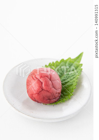 Shiso leaves and pickled plums on a small plate Shiso leaves and pickled plums on a small plate 140991315
