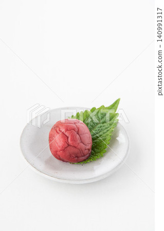 Shiso leaves and pickled plums on a small plate Shiso leaves and pickled plums on a small plate 140991317