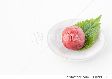 Shiso leaves and pickled plums on a small plate Shiso leaves and pickled plums on a small plate 140991319