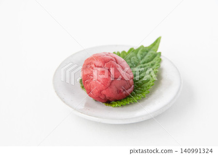 Shiso leaves and pickled plums on a small plate Shiso leaves and pickled plums on a small plate 140991324