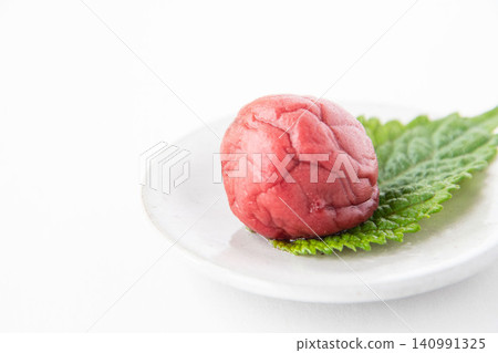 Shiso leaves and pickled plums on a small plate Shiso leaves and pickled plums on a small plate 140991325