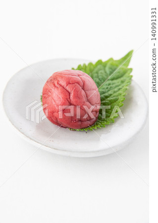 Shiso leaves and pickled plums on a small plate Shiso leaves and pickled plums on a small plate 140991331