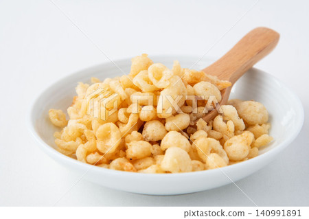 Tempura batter scraps served on a small plate 140991891