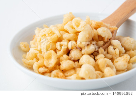 Tempura batter scraps served on a small plate Tempura batter scraps served on a small plate 140991892