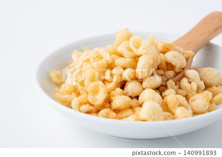 Tempura batter scraps served on a small plate 140991893