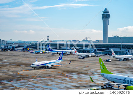 View from the "Sky Deck" at Chubu Centrair International Airport: Passenger planes heading to the runway for takeoff. View from the "Sky Deck" at Chubu Centrair International Airport: Passenger planes heading to the runway for takeoff. 140992076
