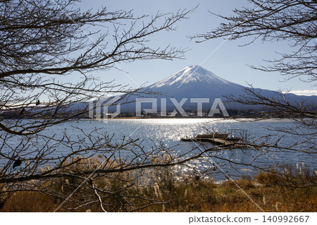 Mount Fuji and Sparkling Lake Kawaguchi on Sunny Day in Japan Mount Fuji and Sparkling Lake Kawaguchi on Sunny Day in Japan 140992667