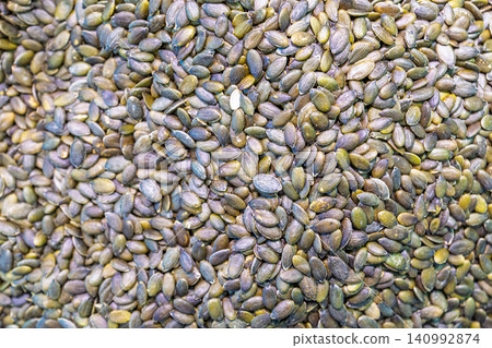 Raw Green Pumpkin Seeds Background Texture Captured at a Local Market in The Netherlands Europe Raw Green Pumpkin Seeds Background Texture Captured at a Local Market in The Netherlands Europe 140992874