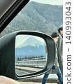 Mount Fuji reflected in a car's side mirror 140993043
