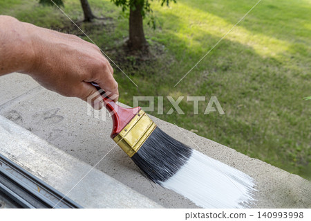 Hand Painting Exterior Wall With Brush. Hand Painting Exterior Wall With Brush. 140993998