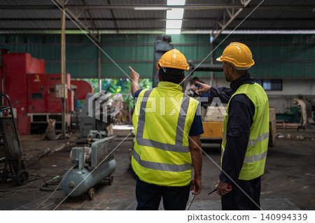 Workers Factory or Engineering work at factory site check up machine or products in site. Workers Factory or Engineering work at factory site check up machine or products in site. 140994339