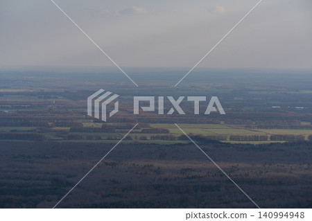 Plains shrouded in a gradient of colors at dusk 140994948