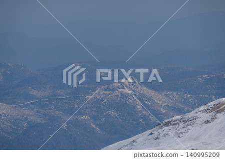 Spring haze, jagged peaks, and blue mountain ranges Spring haze, jagged peaks, and blue mountain ranges 140995209