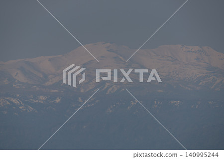The pink of the snow-capped peaks, bathed in the sunset. The pink of the snow-capped peaks, bathed in the sunset. 140995244