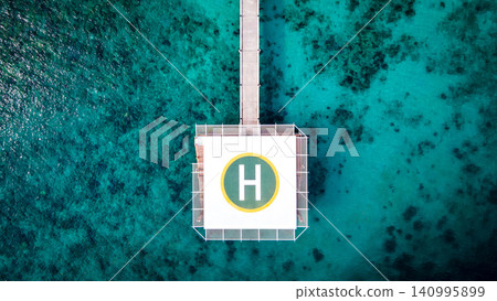 Aerial view of helipad over the sea Aerial view of helipad over the sea 140995899