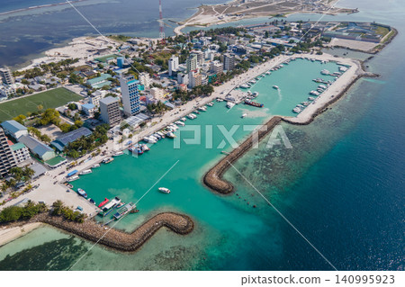 Aerial drone view of Maafushi, one of the inhabited islands of Kaafu Atoll in the Maldives Aerial drone view of Maafushi, one of the inhabited islands of Kaafu Atoll in the Maldives 140995923