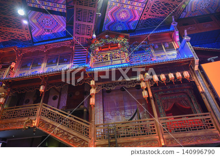 The interior of a traditional Charming Xiangxi Theatre with wooden balconies and patterns in China The interior of a traditional Charming Xiangxi Theatre with wooden balconies and patterns in China 140996790