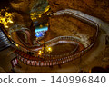 Winding stone staircase in a huge Yellow Dragon Cave in the mountains near Zhangjiajie, China 140996840