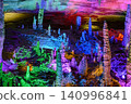 Stalactites and stalagmites colored by light in the huge Yellow Dragon Cave near Zhangjiajie, China 140996841