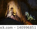 A light projection of a dragon image in the famous huge Yellow Dragon Cave in China 140996851