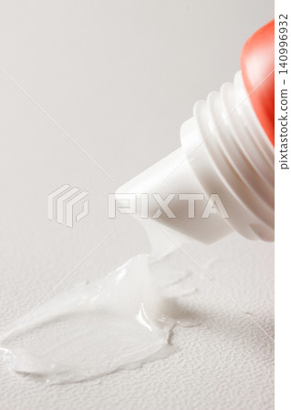 Closeup Lip Balm Smear from Squeeze Tube Closeup Lip Balm Smear from Squeeze Tube 140996932