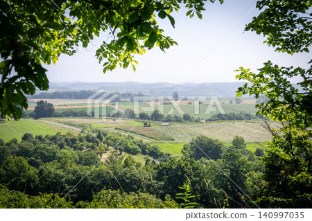 A landscape of the hills of Furano and Biei, photographed under the clear skies of early summer. A landscape of the hills of Furano and Biei, photographed under the clear skies of early summer. 140997035