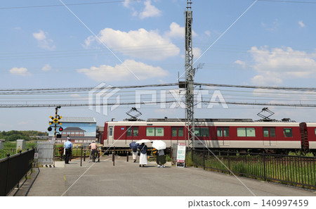 Kintetsu train passing through the Heijo-kyo ruins Kintetsu train passing through the Heijo-kyo ruins 140997459