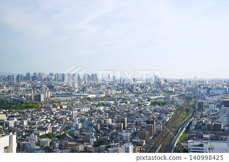 Osaka, Suita City: View of the city from a high-rise building, JR Kyoto Line, Kanzaki River, Osaka Station (southwest from Merode Suita, early summer) Osaka, Suita City: View of the city from a high-rise building, JR Kyoto Line, Kanzaki River, Osaka Station (southwest from Merode Suita, early summer) 140998425